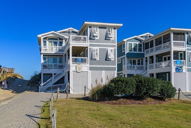 exterior space with driveway and a front lawn