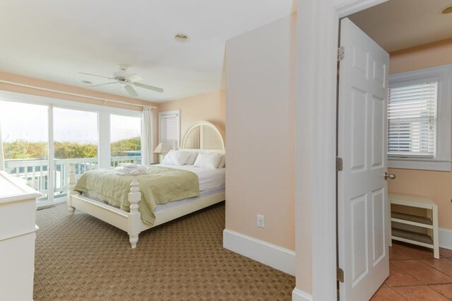 bedroom with access to exterior, baseboards, and a ceiling fan