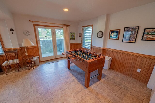 game room featuring recessed lighting, wainscoting, and wooden walls