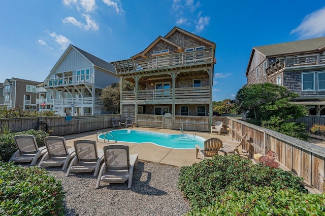 view of pool with a fenced in pool, a fenced backyard, and a patio