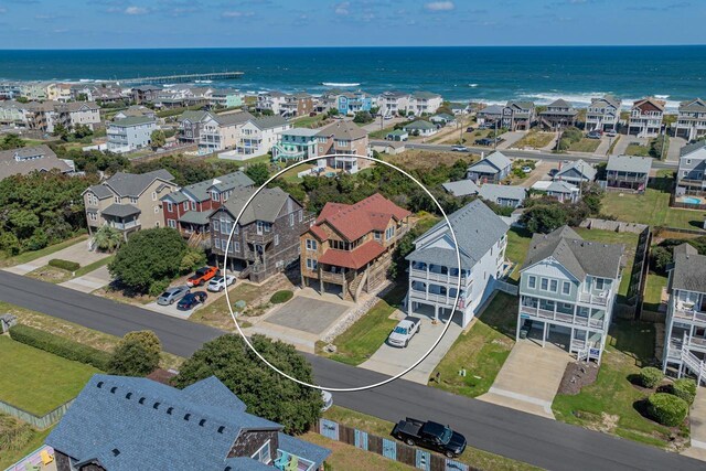 bird's eye view featuring a water view and a residential view