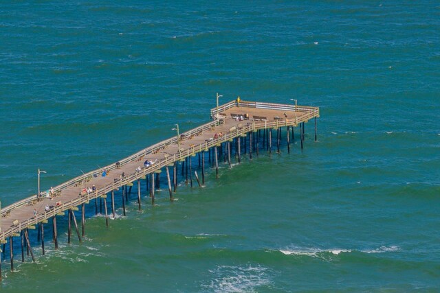 view of dock with a pier and a water view