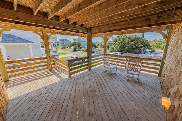 wooden terrace with a residential view