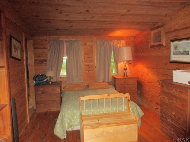 bedroom with multiple windows, wood walls, and wooden ceiling