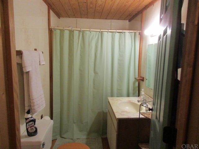 full bathroom with wood ceiling and vanity