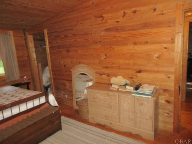 bedroom with wooden walls