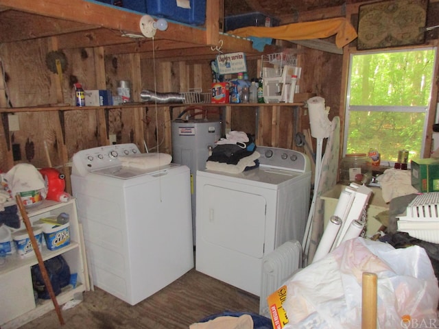 laundry room with water heater and independent washer and dryer