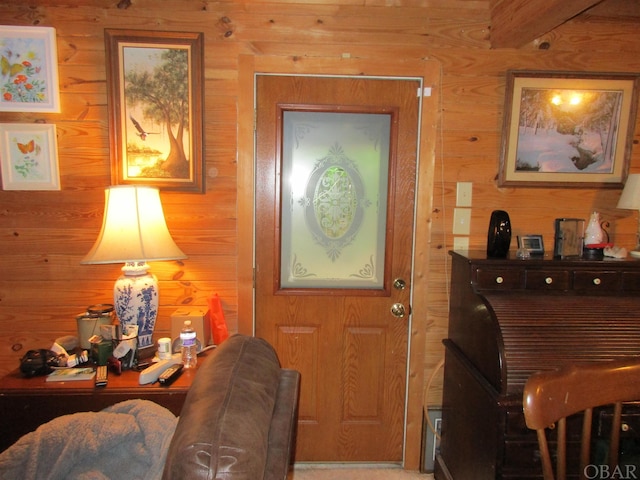 foyer featuring wood walls