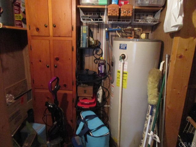 utility room featuring water heater