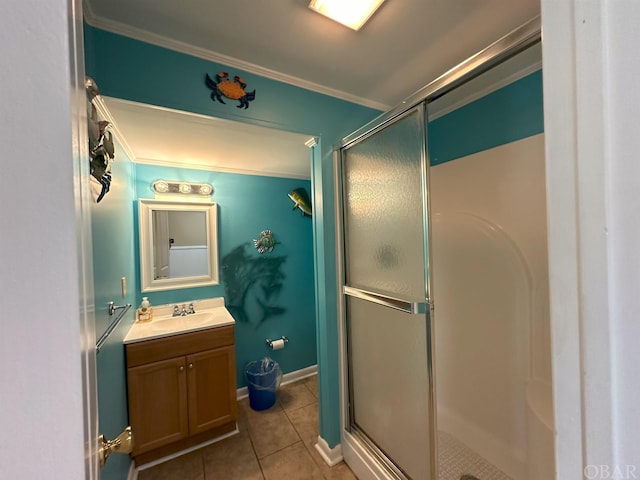 bathroom featuring crown molding, tile patterned flooring, vanity, and a shower stall