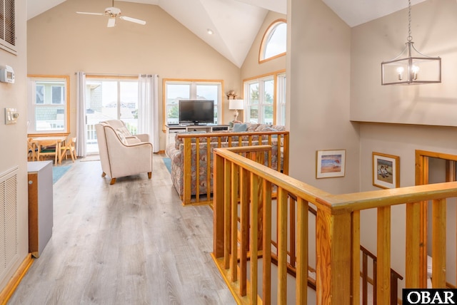 1133 Payson St Lot 120, Corolla, NC 27927 - corridor with wood finished floors, an upstairs landing, high vaulted ceiling, and a chandelier