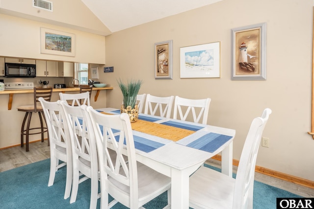 1133 Payson St Lot 120, Corolla, NC 27927 - dining room featuring lofted ceiling and light wood-type flooring