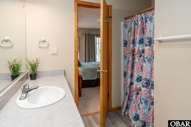 1133 Payson St Lot 120, Corolla, NC 27927 - full bathroom with wood finished floors, vanity, a shower with shower curtain, and ensuite bathroom