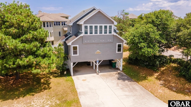 1133 Payson St Lot 120, Corolla, NC 27927 - view of front facade with a carport, driveway, and stairs