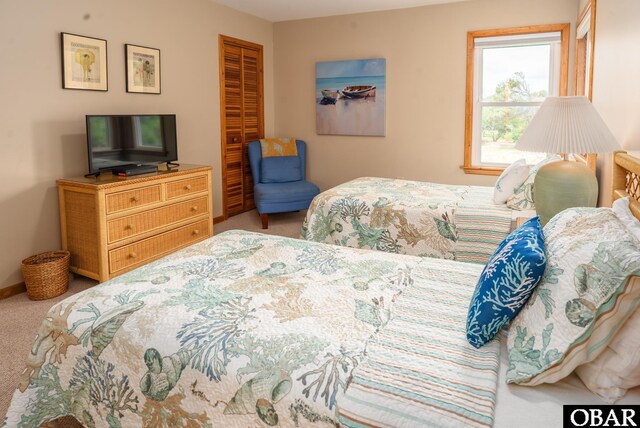 1133 Payson St Lot 120, Corolla, NC 27927 - carpeted bedroom with a closet and baseboards