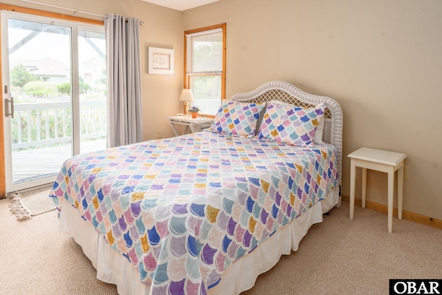 1133 Payson St Lot 120, Corolla, NC 27927 - carpeted bedroom with access to outside and baseboards