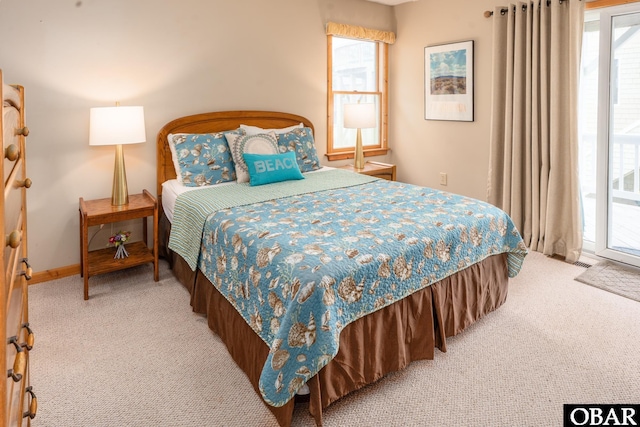 1133 Payson St Lot 120, Corolla, NC 27927 - bedroom with light carpet, access to exterior, and multiple windows