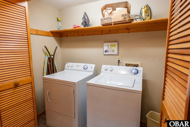 1133 Payson St Lot 120, Corolla, NC 27927 - laundry area featuring washer and clothes dryer and a textured ceiling