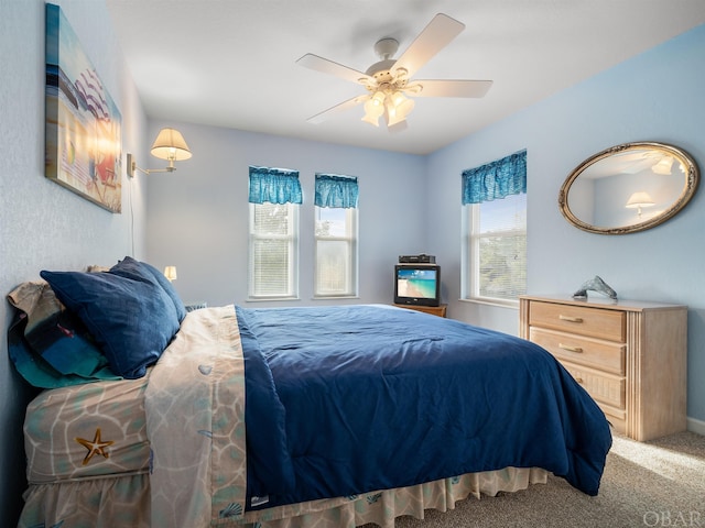 carpeted bedroom with a ceiling fan