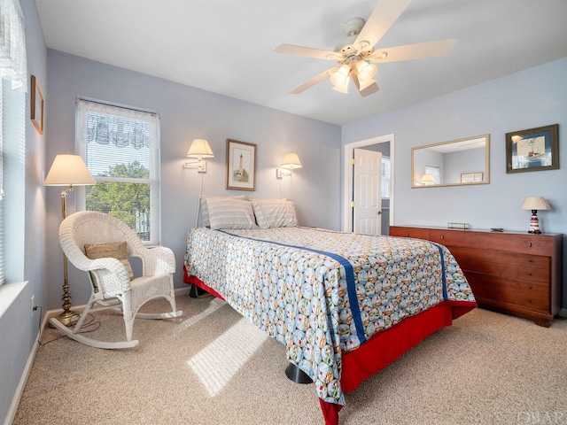 carpeted bedroom featuring a ceiling fan and baseboards