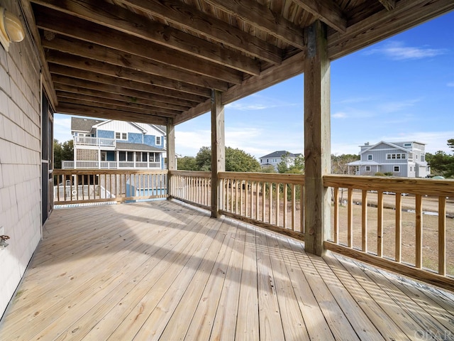 wooden deck with a residential view