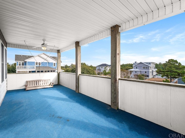 view of patio with ceiling fan and a residential view