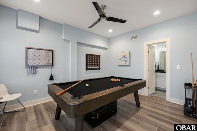 rec room with visible vents, wood finished floors, ceiling fan, and billiards