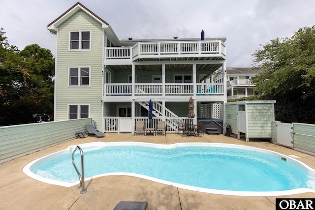 117 Four Seasons Ln Lot 12, Duck, NC 27949 - back of property featuring stairs, a patio, and an outdoor pool