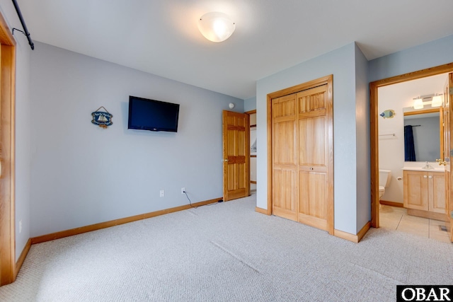 117 Four Seasons Ln Lot 12, Duck, NC 27949 - unfurnished bedroom with light colored carpet, a closet, and connected bathroom