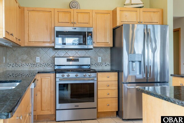 117 Four Seasons Ln Lot 12, Duck, NC 27949 - kitchen with appliances with stainless steel finishes, light brown cabinets, light tile patterned floors, and decorative backsplash