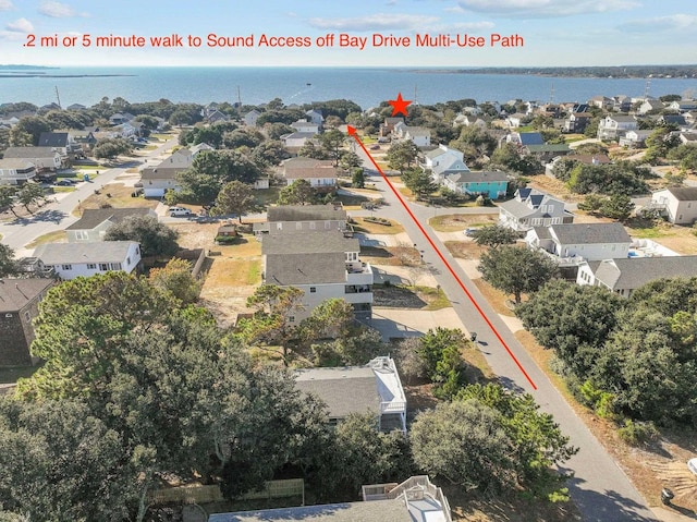 aerial view with a water view and a residential view