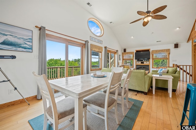 2319 Carova Rd Lot # 22, Corolla, NC 27927 - dining space featuring ceiling fan, high vaulted ceiling, light wood-type flooring, and baseboards