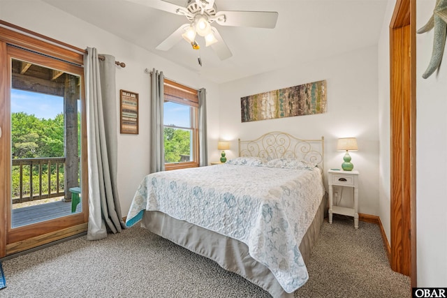 2319 Carova Rd Lot # 22, Corolla, NC 27927 - carpeted bedroom featuring access to exterior, baseboards, and a ceiling fan