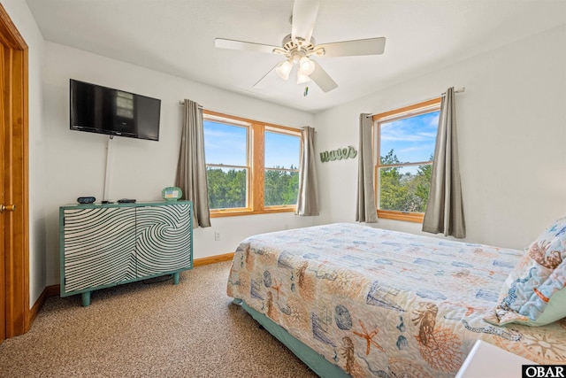 2319 Carova Rd Lot # 22, Corolla, NC 27927 - carpeted bedroom featuring baseboards and a ceiling fan