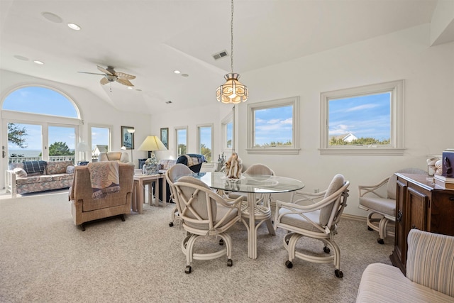 carpeted dining area featuring recessed lighting, vaulted ceiling, visible vents, and plenty of natural light