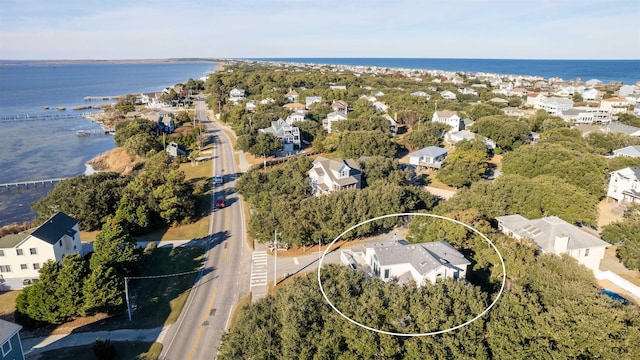 birds eye view of property with a water view and a residential view