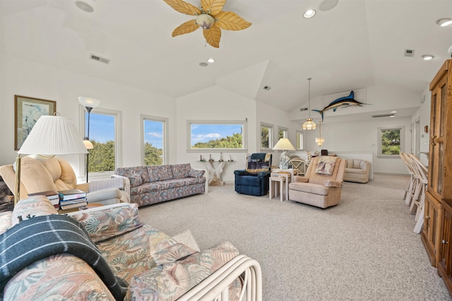 carpeted living room with a healthy amount of sunlight, visible vents, and vaulted ceiling