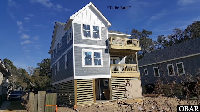 view of front facade featuring board and batten siding and a balcony