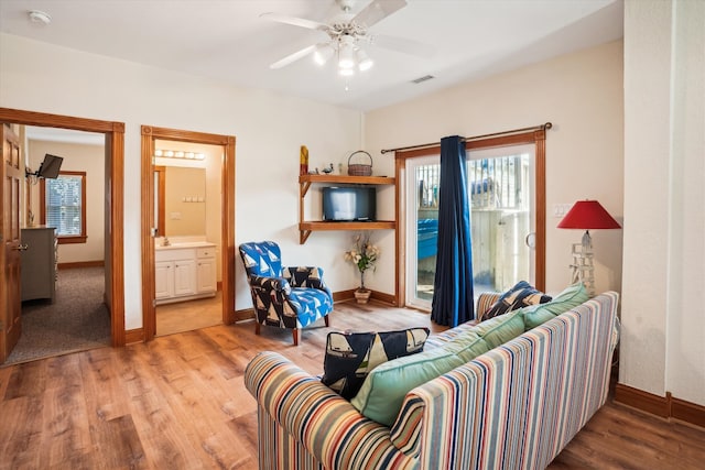 interior space featuring light wood-type flooring, baseboards, and visible vents