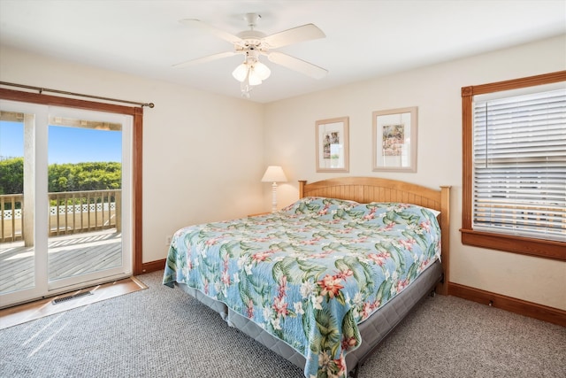 bedroom with baseboards, carpet, visible vents, and access to exterior