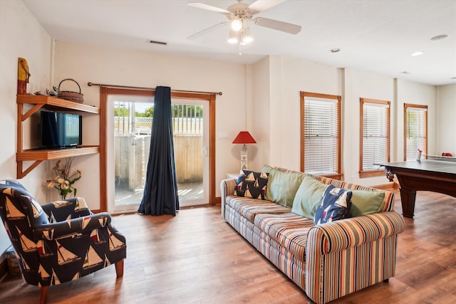 living room featuring ceiling fan, wood finished floors, visible vents, and recessed lighting