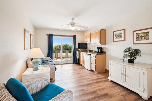 interior space with light wood finished floors, light countertops, light brown cabinetry, a ceiling fan, and dishwasher