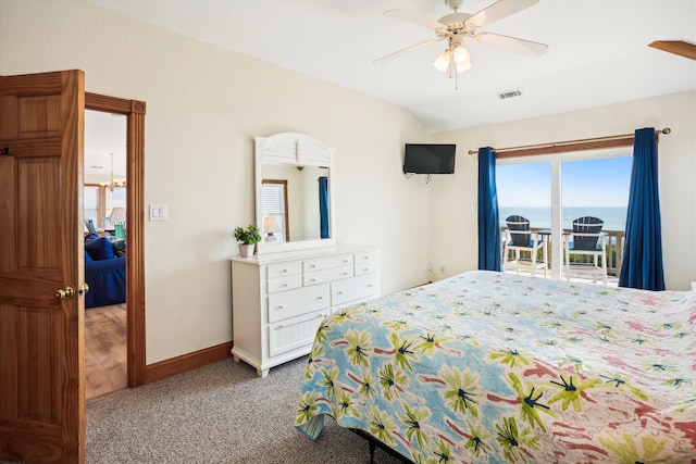 bedroom featuring light colored carpet, visible vents, a ceiling fan, vaulted ceiling, and baseboards