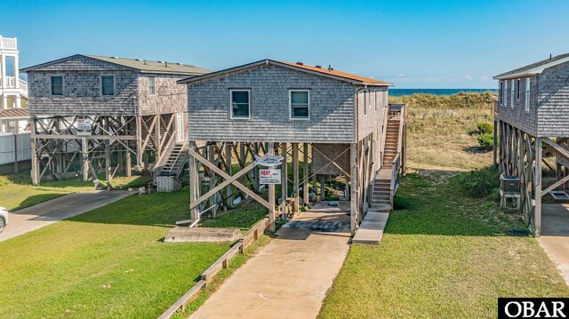 57105 Lighthouse Rd Lot 2, Hatteras, NC 27943 - view of front facade with stairs and a front lawn