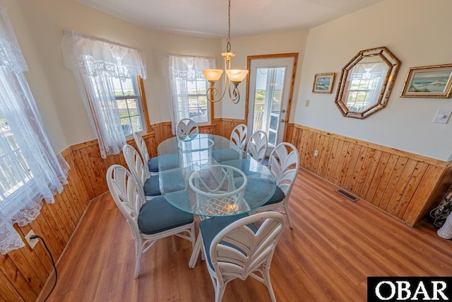 26509 Colony Dr Lot 6, Salvo, NC 27972 - dining room with wainscoting, wood walls, and light wood-style floors