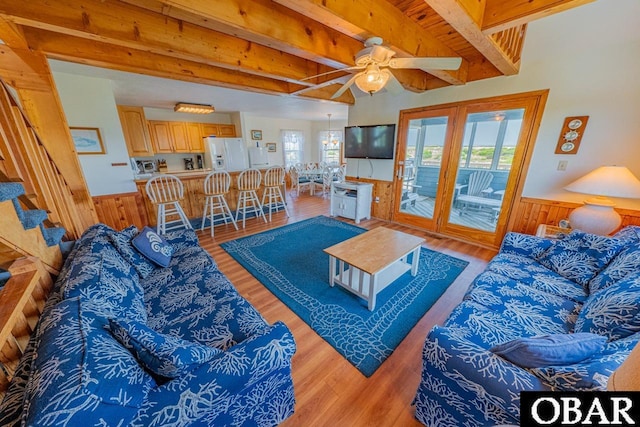 26509 Colony Dr Lot 6, Salvo, NC 27972 - living room with light wood-type flooring, a wainscoted wall, wood walls, ceiling fan, and stairway