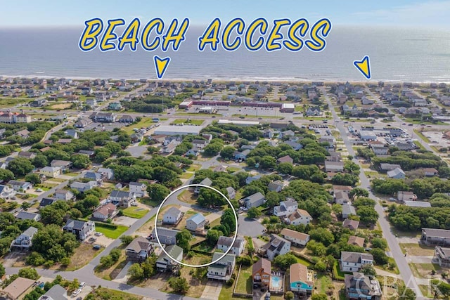 bird's eye view with a residential view and a water view