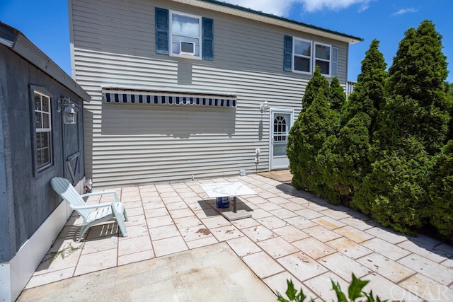 rear view of house with a patio area