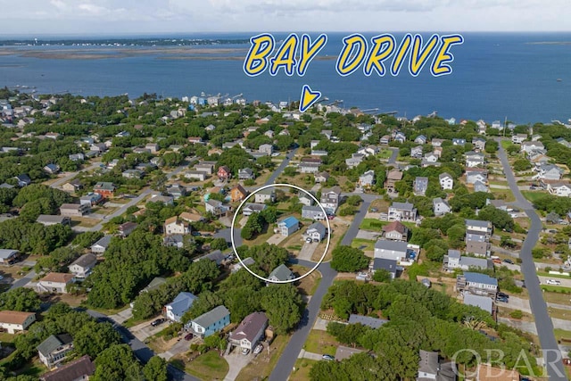 bird's eye view featuring a residential view and a water view