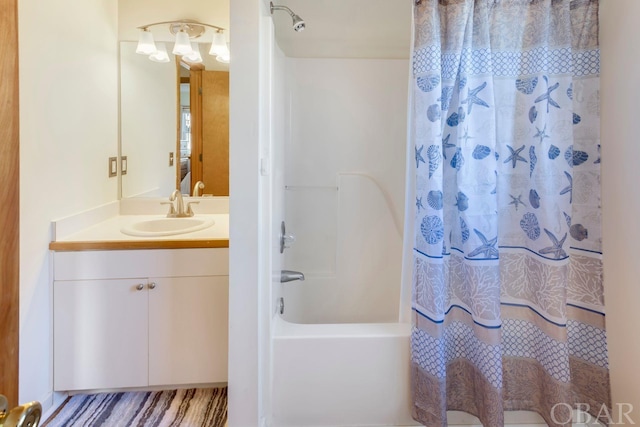 bathroom with shower / tub combo and vanity